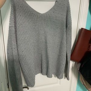 Light grey francesca’s sweater with semi open back